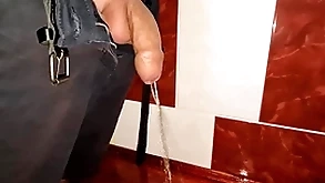 Laconic uncut cock pissing