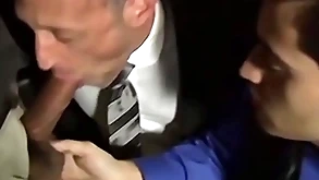 Bald bearded plank sucking several cocks in an orgy