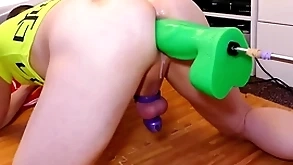 Mike trying out a catch obese miserly green boogeyman dildo for size while locked in chastity
